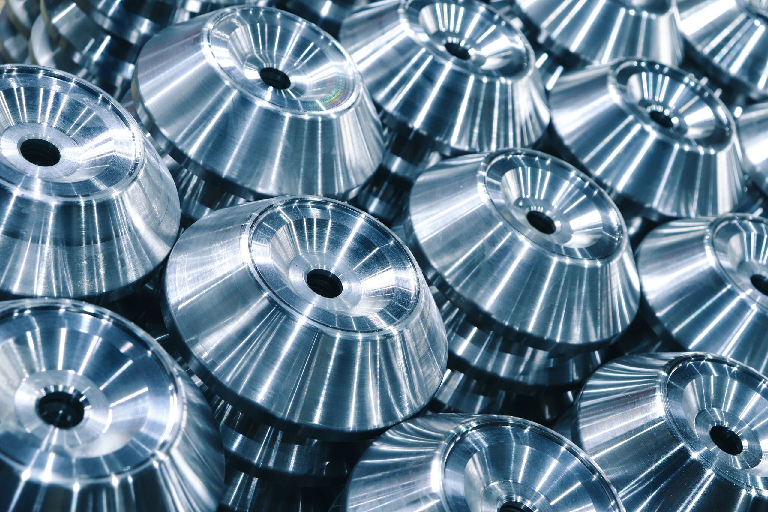 Steel machined components arranged in production rows