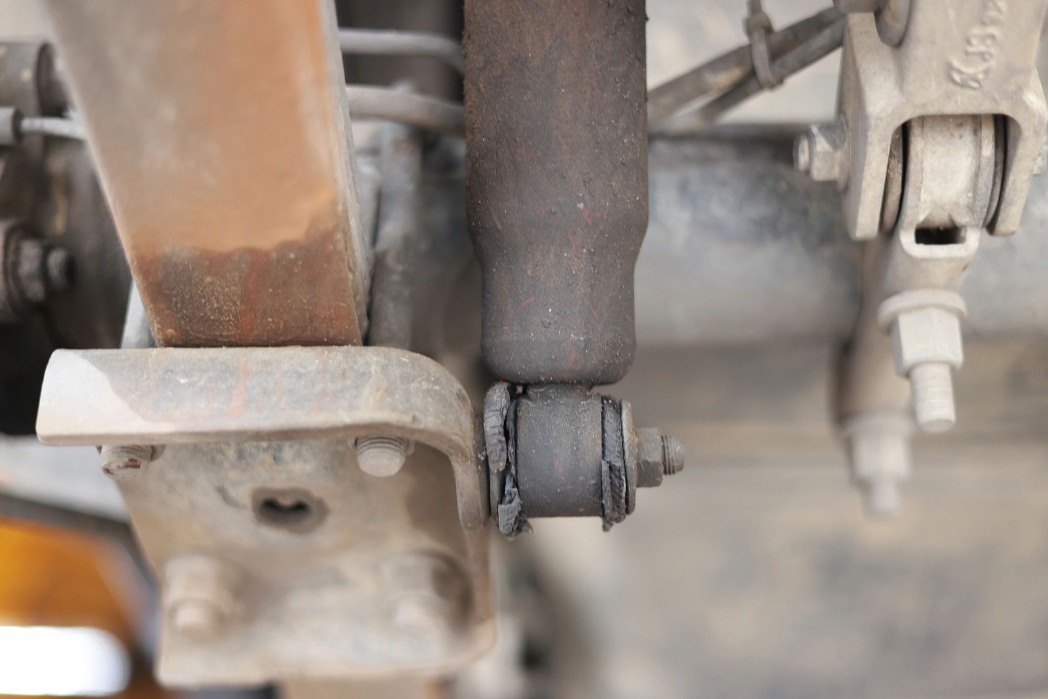 Vehicle underbody area showing aftermarket mount and suspension application