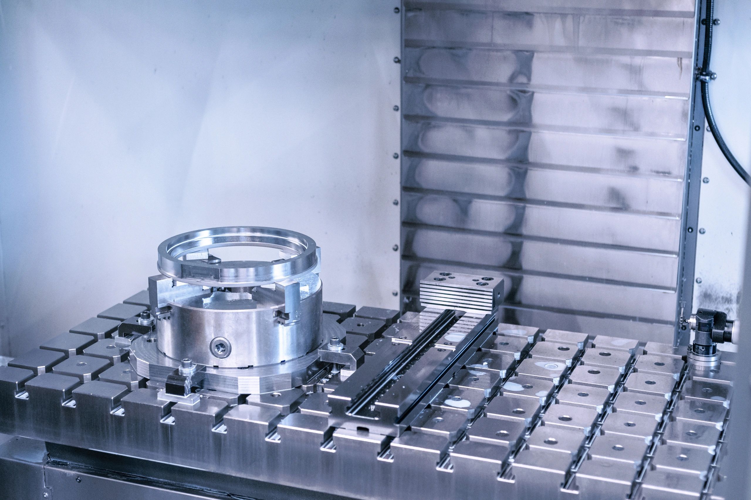 Machined custom metal product on industrial work panel