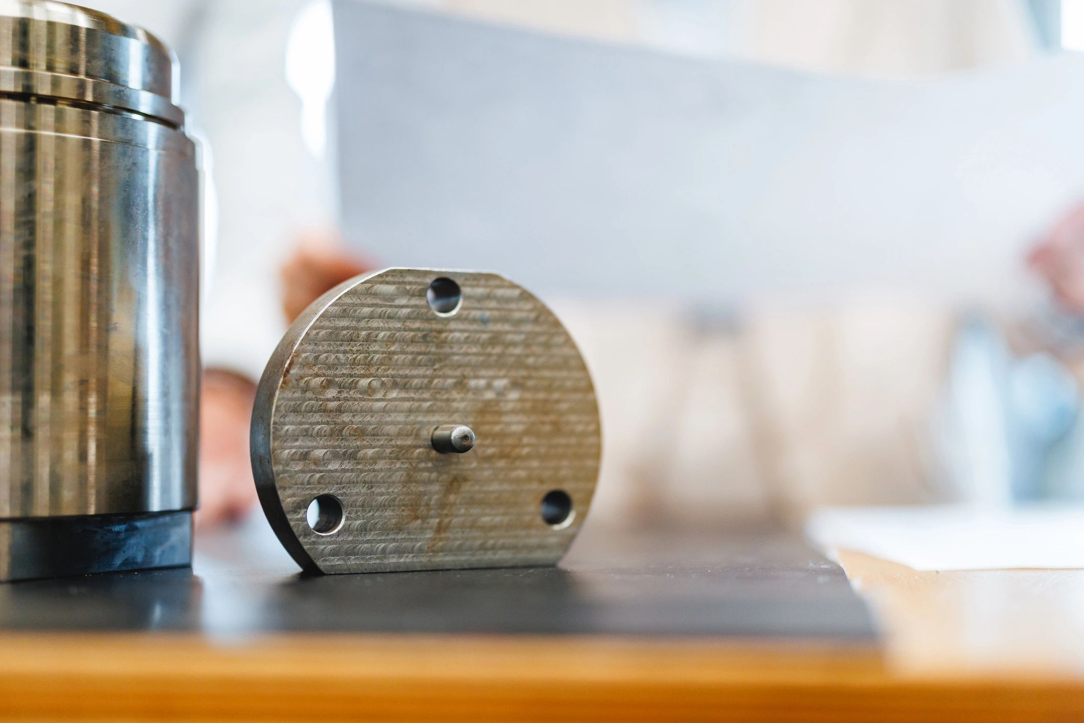 Precision metal component with machined holes