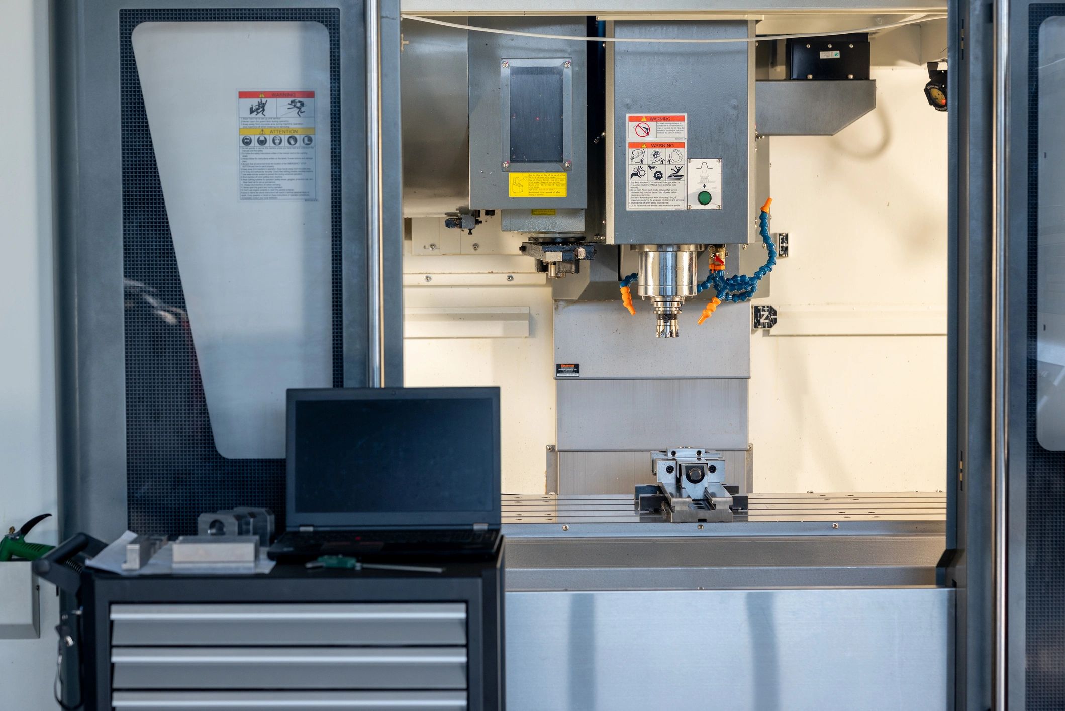 Interior of CNC vertical milling machine with workpiece