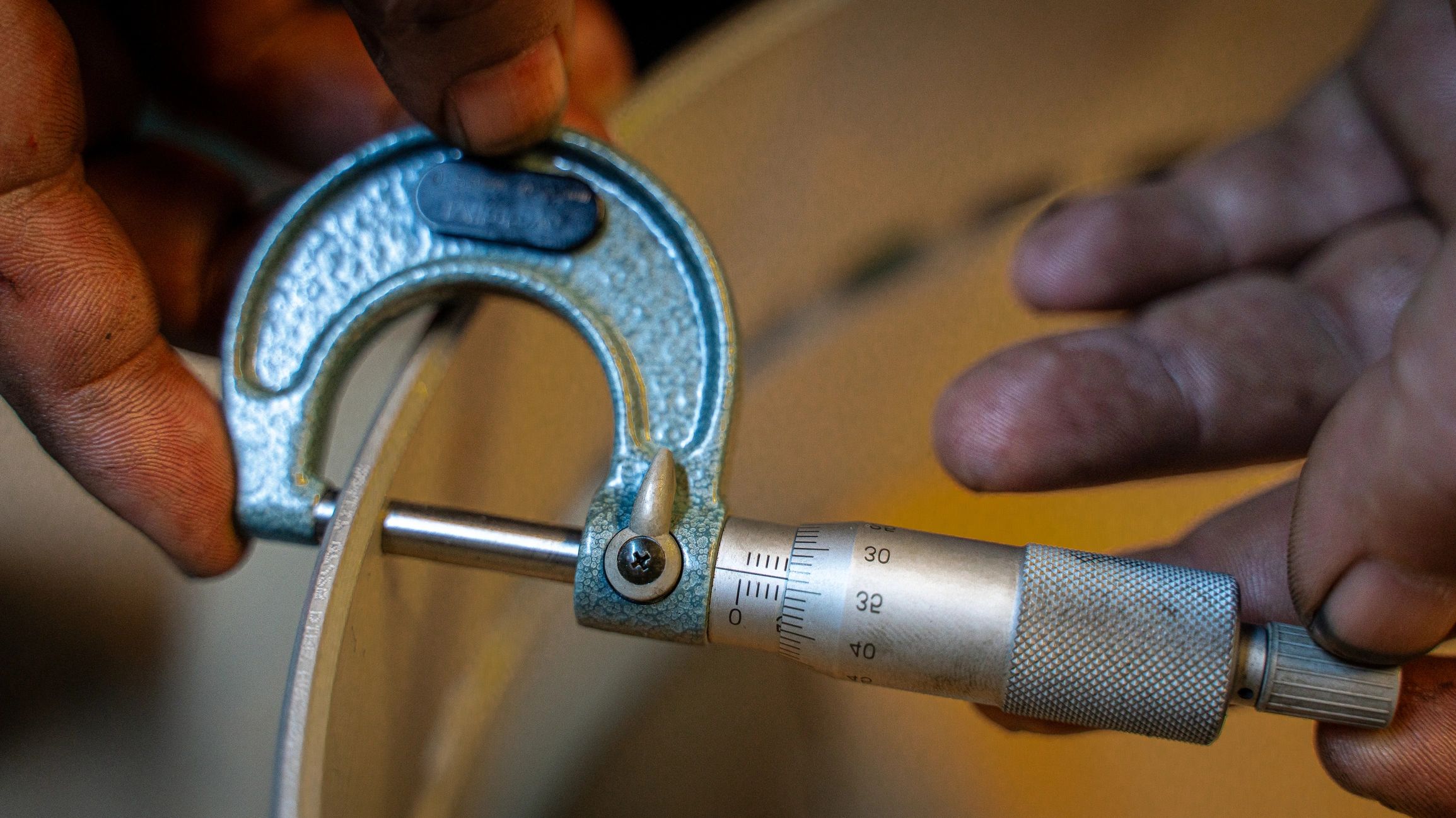 Precision measurement of a metal bearing with a micrometer